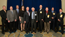 Rep. Sandy Levin, (D-MI-9th), sixth from left, with the L-169 delegation and IP Newton Jones, fifth from left; IVP Larry McManamon, third from left; IR Len Gunderson, third from right; and IR Don Hamric, far right.