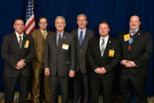 Rep. Rick Nolan (D-MN-8th), third from left, with IVP Larry McManamon, fourth from left; and l. to r., L-647 delegates Matt Olsen, Stacey Bendish, Derek McPheeters, and Keenan Retterath.