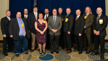 Rep. Denny Heck (D-Wash-10th), center front, with IVP J. Tom Baca, sixth from left, Gary Powers, AD-ISO, far left; and delegates from the state of Washington.