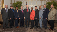 Rep. Bill Foster (D-IL 11th), fifth from left, with, l. to r., IR Bill Staggs; Gary Lusk, L-60; Eli Matthews, L-1247; IP Newton Jones; James Young, L-1247; Kirk Cooper, L-60; IR Miguel Fonseca; IVP Larry McManamon; and ED-QCCUS/AD-CSO Eugene Forkin. 